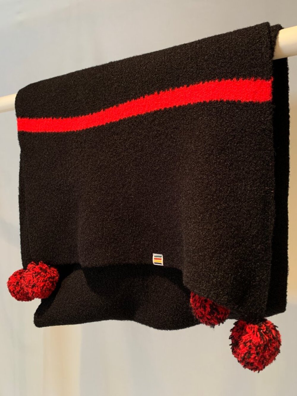 Black Knit Scarf with Pompoms and HBC Stripes Detail